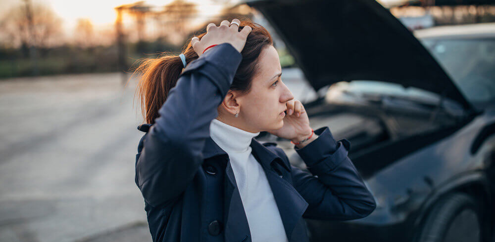 Stressed woman calling for help after a car accident Stressed woman calling for help after a car accident