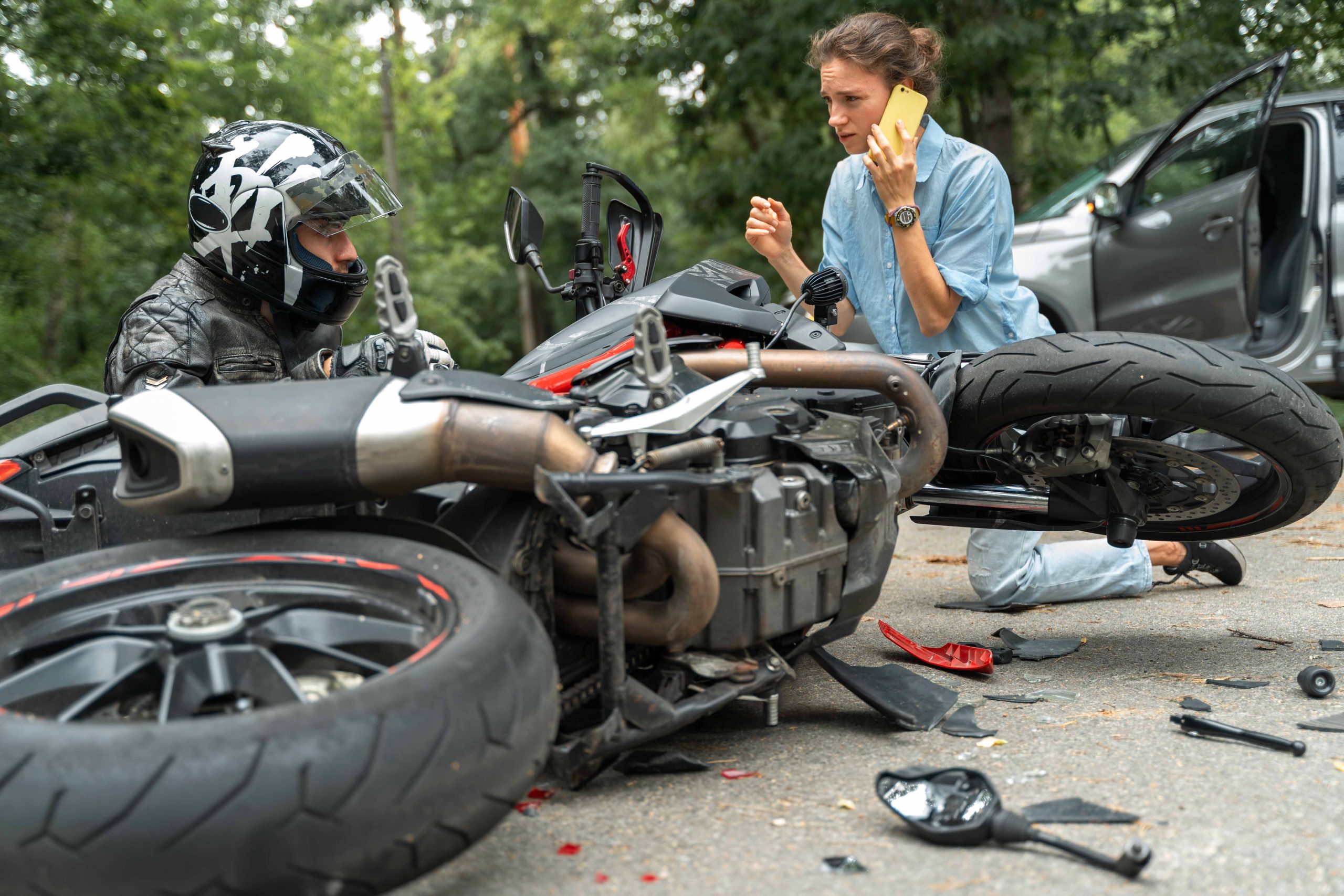 Motorcycle Accident and woman on phone